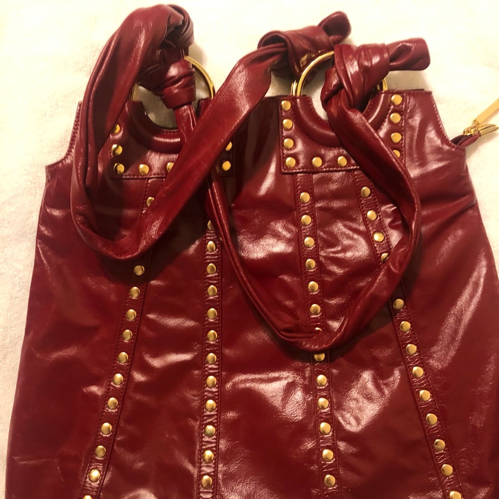 Red & gold “The Find” purse. Wrap around gold rings.